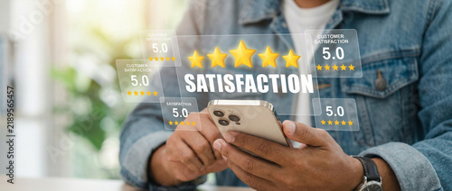 Person holding smartphone with glowing five star satisfaction rating hologram