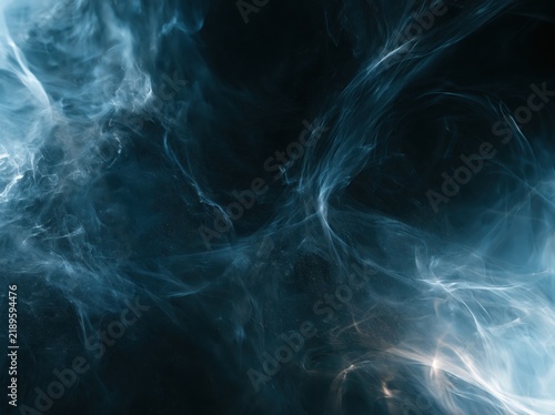 Abstract dark blue smoke swirling on a black background