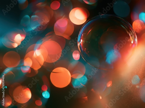 Soap bubble with colorful bokeh lights background