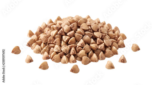 A pile of buckwheat groats against a black background healthy whole grain