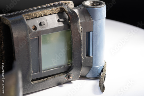 Cuadro en lienzo Emergency pager in worn leather holster with open cover isolated on white backgr