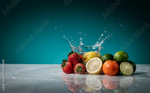 Fresh assorted fruit with water splash on marble table strawberry refreshing reflection background nutrition lifestyle culinary ingredients composition wellness