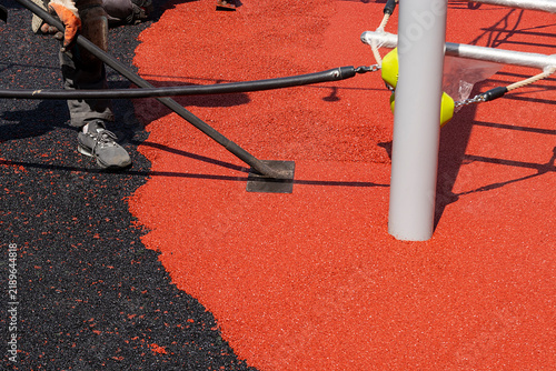 smoothing sports surface with hot steaming trowel