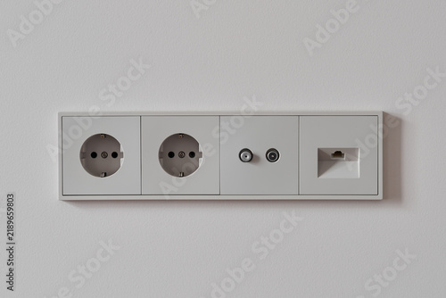 Cuadro en lienzo White wall outlet panel with flush faceplate, two round power sockets, coax conn