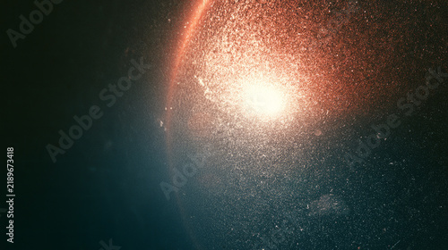 Cinematic film grain texture with soft light leaks, vintage analog photography aesthetic on dark background, grainy noise overlay for retro video editing and nostalgic creative design work