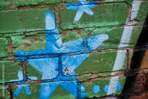 Graffiti - Wolverhampton 2026 - close up - faded details of a star showing wear in blues and greens