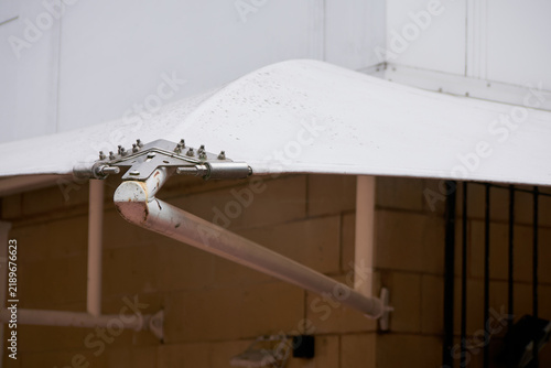 Detail of a commercial building canopy showing the fixings that hold it in place