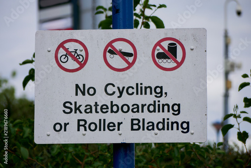 Sign, No cycling, skateboarding or roller blading, No Fun.