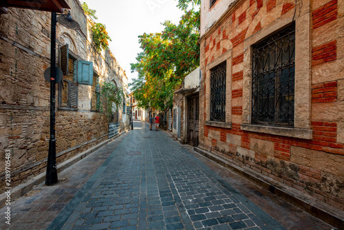 Antalya, Turkey - August 27, 2026: The image shows a historic cobblestone street in Kaleiçi, the old town of Antalya, Türkiye, featuring traditional Ottoman-style architecture and ancient stone. Histo