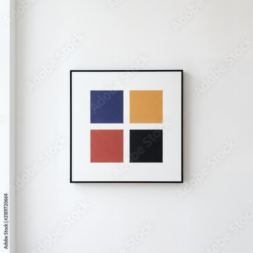 Four-color geometric abstract artwork with blue, ochre, red and black squares