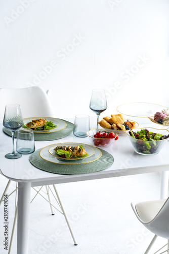 Breakfast at the hotel. A dining table with food and drinks in a bright room.
