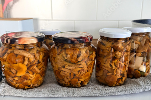 Canning chanterelle mushrooms in jars. Selective focus.