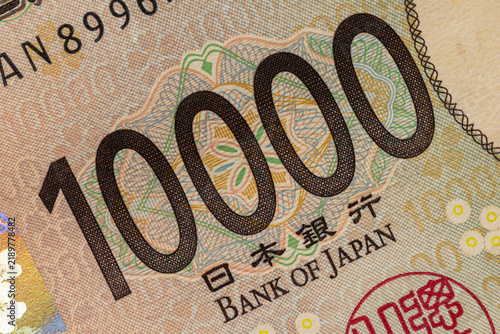 Japanese yen 10000 bill number macro close up with Bank of Japan inscription