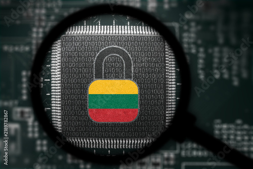 Computer chip with Lithuania flag. View through magnifying glass. Hackers launch cyber attacks. Hackers violate privacy. Hacker is searching  personal data.
