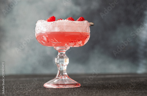 Tapety artystyczne Elegant Clover Club cocktail with velvety foam fresh raspberries and vintage crystal glass