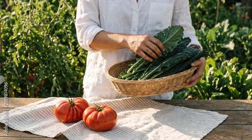 Woman harvesting fresh kale and heirloom tomatoes from a home garden. Showcasing sustainable living, healthy eating, and the joy of homegrown organic produce for a natural lifestyle.