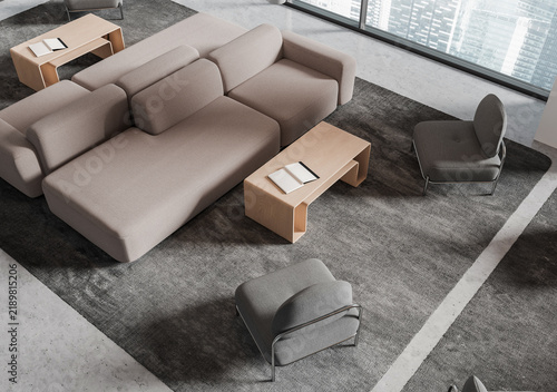 Modern living room interior with modular sofas, lounge chairs, wood tables, and city windows in a realistic style on a neutral rug, 3D Rendering
