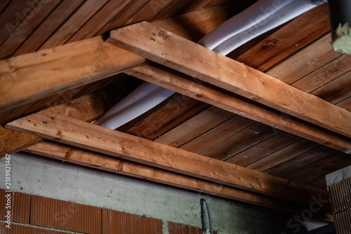 фотографія Timber roof construction seen from inside the attic of a new house
