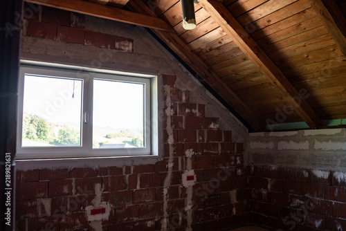 Quadro su tela Timber roof construction seen from inside the attic of a new house