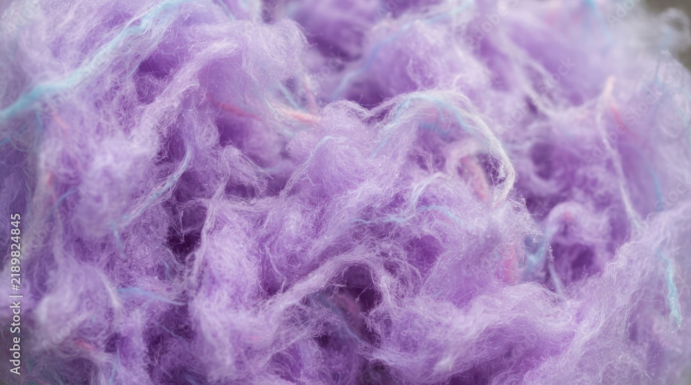 Obraz premium Close-up of soft purple wool fibers with subtle blue and pink strands