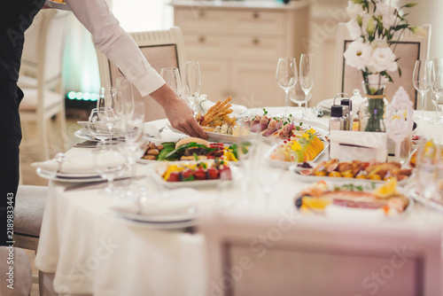 Luxurious banquet setting with catering service and a variety of delicious dishes on beautifully arranged table