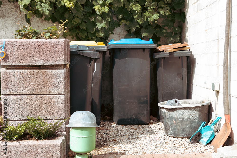 Obraz premium A view of part of the service yard, featuring waste sorting bins.