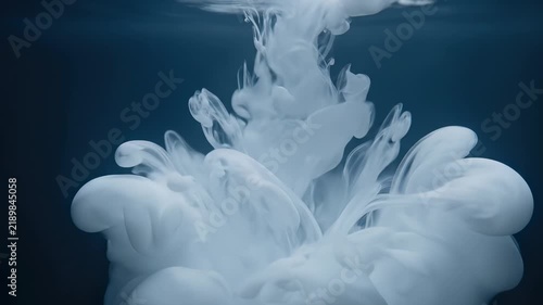 Abstract White Ink Plume Expanding in Dark Water