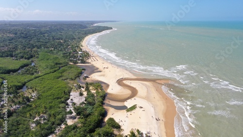 Fantastic aerial view of Nativos Beach with white sand, coconut trees and tropical nature in Trancoso, Bahia, Brazil