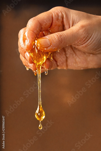Hand Pouring Honey