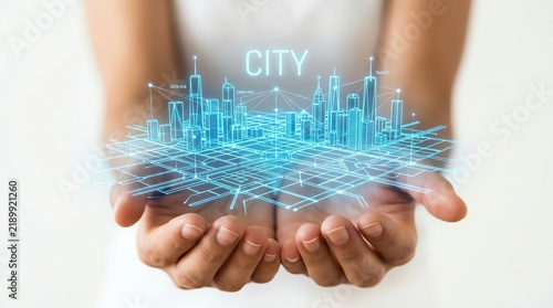 Futuristic digital smart city hologram held in open hands with glowing urban architecture and interconnected blue network data visualization