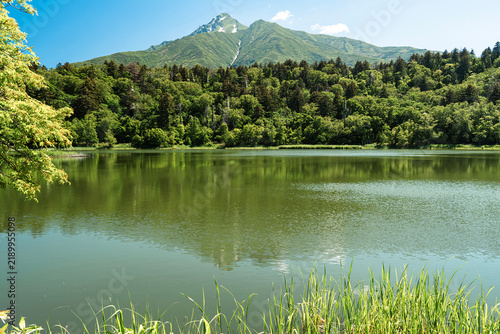 Mount Rishiri rising behind Himenuma Pond under clear skies, Rishiri Island