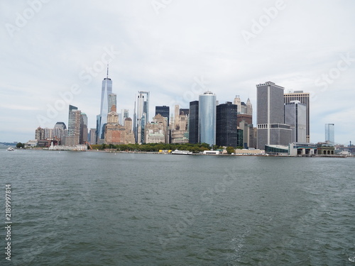 Panoramic skyline view of Lower Manhattan and One World Trade Center from the water in New York