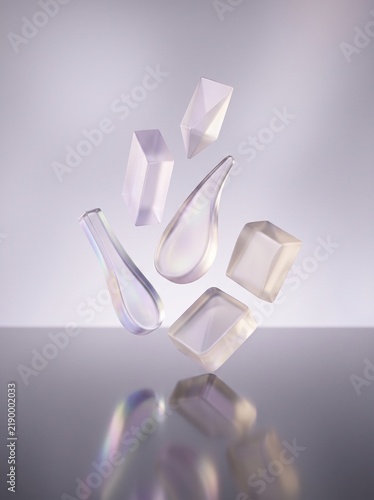 Futuristic transparent acrylic shapes floating in mid-air. Architectural 3D geometric forms. Clear synthetic resin art decoration. Abstract minimalist white design background.