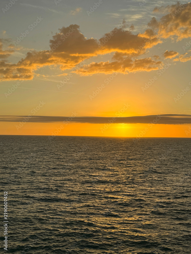 Fototapeta premium Dusk sky over ocean vertical