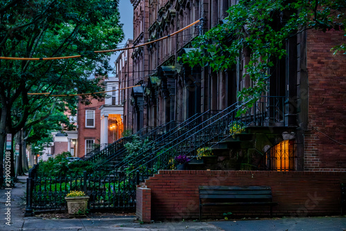 Historic stone church architecture and classic brick townhouses in downtown New Haven Connecticut