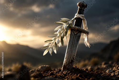 Heavy sword plunged into earth with a white olive branch tied to its hilt.