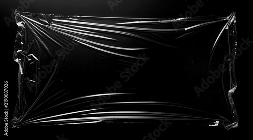Transparent Plastic Wrap Texture on Black Background.