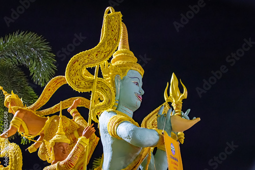 Buddhist Lent tradition, a beautiful display of wisdom, beeswax candles create art as a Buddhist offering.Background with Thai pattern carved on the surface of Lent candle.Ubon Ratchathani.Festival