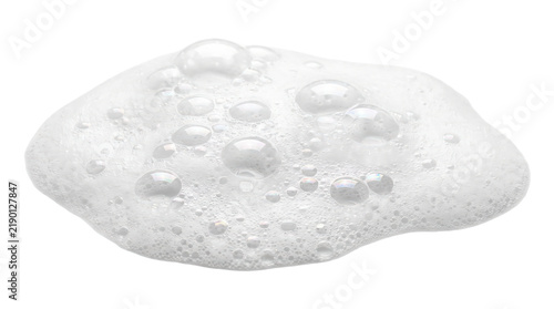 A macro close-up of white soapy foam with delicate bubbles, lather, and suds arranged in an organic smear shape, isolated on a transparent background.