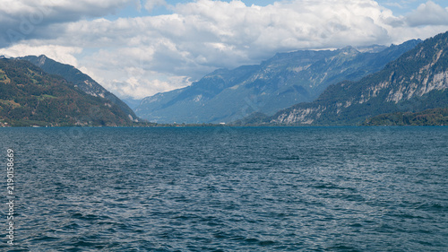 Scenic view of Lake Thun (Thunersee) with Swiss Alps mountains looking towards Interlaken, Switzerland