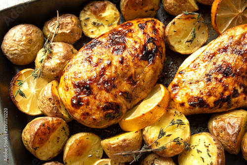 Oven roasted lemon garlic chicken and baby potatoes with herbs