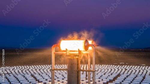 Dusk-lit CSP receiver blazing over rows of desert solar mirrors