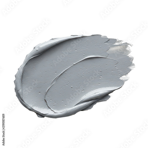 A single grey cosmetic clay face mask smear texture with scrub particles for beauty and skincare treatment use