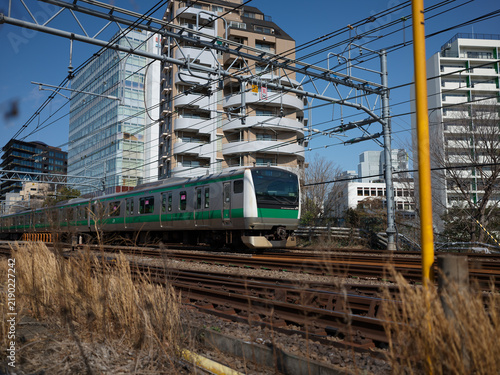 Konstfotografi Commuter trains on an elevated railway beside apartment towers, Japan