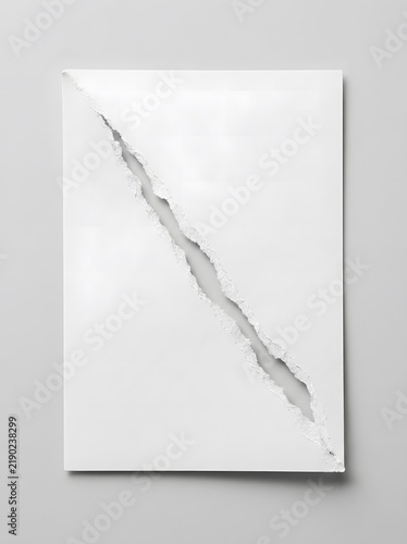Torn white paper sheet with diagonal rip