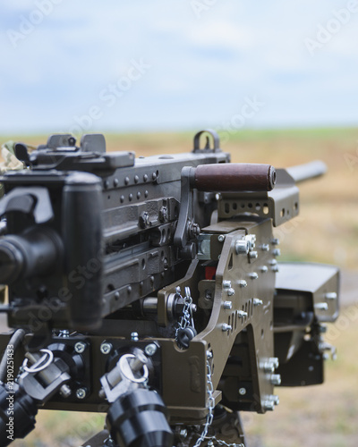 Fotografie Сlose up of a heavy machine gun mounted on an unmanned robotic ground vehicle