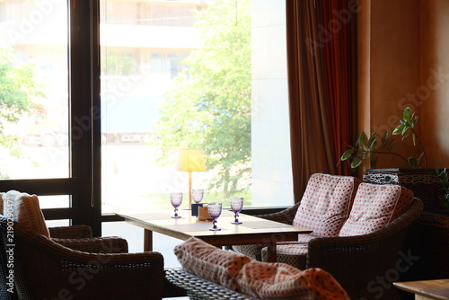 Canvastavla Tranquil cafe space illuminated by sunlight with relaxing ambiance
