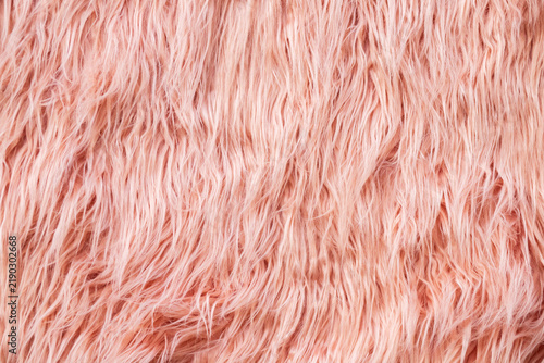 Bild auf Leinwand soft pink faux fur fills the frame with long wavy fibers, creating a plush texti