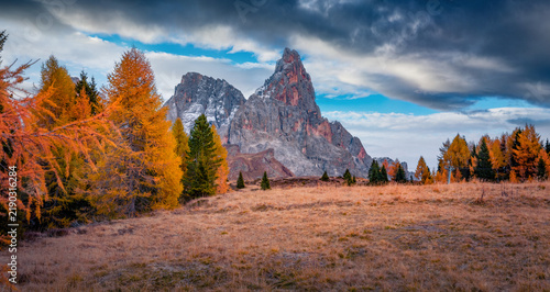 Gloomy autumn view of Cimon della Pala peak. Stunning evening view of Dolomite Alps. Wonderful outdoor scene of Italy, Europe. Traveling concept background.
