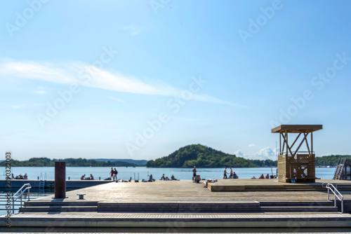 Sørenga pier in Oslo Fjord with people relaxing